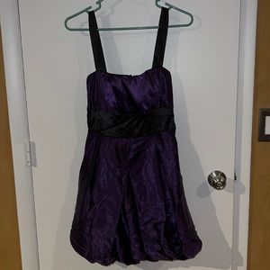 Purple dress with black straps and bow. Size 9